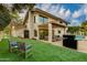 Expansive backyard featuring lush artificial turf, outdoor seating, a barbecue, and a sparkling pool, perfect for outdoor living at 7721 N Via De La Montana --, Scottsdale, AZ 85258