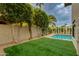 A lush backyard featuring an inviting pool and well-maintained artificial turf at 7721 N Via De La Montana --, Scottsdale, AZ 85258