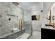 Luxurious shower with modern fixtures, a built-in bench, and beautiful tile work and glass door at 7721 N Via De La Montana --, Scottsdale, AZ 85258