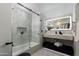 This bathroom features marble-style walls, a shower-tub combination, and a vessel sink with LED mirror at 7721 N Via De La Montana --, Scottsdale, AZ 85258
