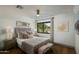 Bedroom boasts natural light, hardwood flooring, a ceiling fan, and a relaxing atmosphere at 7721 N Via De La Montana --, Scottsdale, AZ 85258