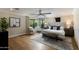 Spacious bedroom with hardwood floors, neutral walls, ceiling fan, and large window with natural light at 7721 N Via De La Montana --, Scottsdale, AZ 85258