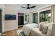 This bedroom features a large window, ceiling fan, and mirrored closet doors, creating a bright and airy space at 7721 N Via De La Montana --, Scottsdale, AZ 85258