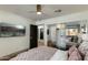 Cozy bedroom with hardwood flooring, neutral walls, a ceiling fan, and a built-in closet at 7721 N Via De La Montana --, Scottsdale, AZ 85258