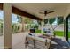 Outdoor covered patio with comfortable seating, a ceiling fan, and an outdoor grill at 7721 N Via De La Montana --, Scottsdale, AZ 85258