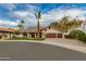 Attractive exterior showcasing lush landscaping, a three-car garage, and a welcoming entrance at 7721 N Via De La Montana --, Scottsdale, AZ 85258