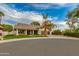 Charming exterior featuring a well-manicured lawn, a three-car garage, and elegant landscaping at 7721 N Via De La Montana --, Scottsdale, AZ 85258