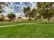 Expansive green space with lush grass and mature trees, creating a serene and inviting environment at 7721 N Via De La Montana --, Scottsdale, AZ 85258