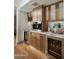 Custom kitchen with built-in wine coolers, espresso machine, and marble countertops at 7721 N Via De La Montana --, Scottsdale, AZ 85258