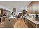 Bright and modern kitchen with stainless steel appliances, white countertops, and wood cabinets at 7721 N Via De La Montana --, Scottsdale, AZ 85258