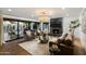 Sophisticated living area with fireplace, modern furniture, and seamless indoor-outdoor flow at 7721 N Via De La Montana --, Scottsdale, AZ 85258