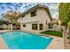 Inviting pool with cool blue water, surrounded by a well-manicured lawn and a view of the home at 7721 N Via De La Montana --, Scottsdale, AZ 85258