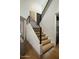 Modern staircase with black metal railing and wood treads illuminated by embedded step lights at 7721 N Via De La Montana --, Scottsdale, AZ 85258