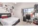 Cozy bedroom features a large window with desert views, stylish decor, and a comfortable workspace at 819 N College Ave # K136, Tempe, AZ 85288