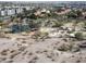 An aerial view captures the beauty of the neighborhood park with lake, playground, and desert landscaping at 819 N College Ave # K136, Tempe, AZ 85288