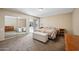 Bright bedroom with sliding glass doors leading to the patio and mirrored closet doors at 9021 E Palmer Dr, Sun Lakes, AZ 85248