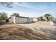 Charming single-story home featuring a well-maintained exterior and an expansive driveway at 9021 E Palmer Dr, Sun Lakes, AZ 85248