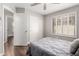 Bedroom with a ceiling fan, shuttered windows, closet, and neutral tones at 904 W Horseshoe Ave, Gilbert, AZ 85233