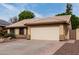 Exterior shot showcases a two-car garage and desert landscaping at 904 W Horseshoe Ave, Gilbert, AZ 85233