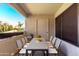 Welcoming balcony with outdoor dining set, creating an inviting atmosphere for entertaining at 9990 N Scottsdale Rd # 2049, Paradise Valley, AZ 85253