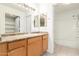 Bathroom with lots of lighting, a full tub, and storage shelves at 9990 N Scottsdale Rd # 2049, Paradise Valley, AZ 85253