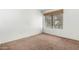 Vacant bedroom featuring neutral carpet and window with blind at 9990 N Scottsdale Rd # 2049, Paradise Valley, AZ 85253