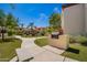 Building with outdoor grill, walkway, and landscaping at 9990 N Scottsdale Rd # 2049, Paradise Valley, AZ 85253