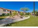 Exterior view of building with lush landscaping and walking path at 9990 N Scottsdale Rd # 2049, Paradise Valley, AZ 85253