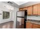 Kitchen featuring stainless steel appliances, wood cabinets, and a view to the dining room at 9990 N Scottsdale Rd # 2049, Paradise Valley, AZ 85253