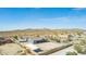 An aerial view shows the roof with solar panels and the custom outdoor living space at 10203 N Burris Rd, Casa Grande, AZ 85122