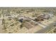 This aerial view shows the desert landscape and custom homes in the area at 10203 N Burris Rd, Casa Grande, AZ 85122