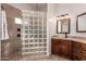 Elegant bathroom with a glass-block shower, stylish vanity, and modern fixtures at 10203 N Burris Rd, Casa Grande, AZ 85122