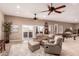 Relaxing living room showcasing comfortable seating, tile flooring, and access to the backyard at 10203 N Burris Rd, Casa Grande, AZ 85122