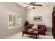 Comfortable living room with plantation shutters, and leather couch at 10203 N Burris Rd, Casa Grande, AZ 85122