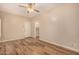 Bedroom featuring a ceiling fan, wood-style floors, and an open doorway at 10339 E Juanita Ave, Mesa, AZ 85209