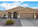 Charming single-story home featuring a well-manicured desert landscape and a two-car garage at 10339 E Juanita Ave, Mesa, AZ 85209