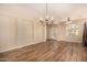 Spacious living room with tile flooring, a chandelier, and a ceiling fan at 10339 E Juanita Ave, Mesa, AZ 85209