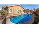 Backyard features inground pool with spa, desert landscaping, and stucco house at 10339 E Juanita Ave, Mesa, AZ 85209