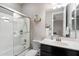 Bathroom featuring shower over tub, single sink vanity, and mirrored medicine cabinet at 10702 E Sheffield Dr, Mesa, AZ 85212