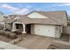 Beautiful home with a brick driveway, covered entry, and a pristine two-car garage at 10702 E Sheffield Dr, Mesa, AZ 85212