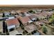 Aerial image featuring a backyard with a pool, desert landscaping, and a patio with a firepit at 10758 E Peralta Canyon Dr, Gold Canyon, AZ 85118