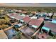 Aerial view of desert homes with backyard pool, patio, firepit and lush desert landscaping at 10758 E Peralta Canyon Dr, Gold Canyon, AZ 85118