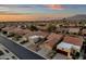 Overhead view of desert homes featuring well-kept yards and clay tile roofs in a close-knit neighborhood at 10758 E Peralta Canyon Dr, Gold Canyon, AZ 85118