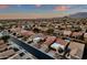 Expansive aerial view of a desert neighborhood showcasing neatly arranged homes with red tile roofs at 10758 E Peralta Canyon Dr, Gold Canyon, AZ 85118