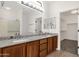 Bathroom featuring granite countertops, double sinks, and lots of natural light at 10758 E Peralta Canyon Dr, Gold Canyon, AZ 85118