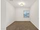 An empty bedroom with natural light and carpet at 10758 E Peralta Canyon Dr, Gold Canyon, AZ 85118