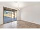 Bright dining area with sliding glass doors leading to the outdoor patio and backyard at 10758 E Peralta Canyon Dr, Gold Canyon, AZ 85118