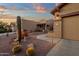 Inviting single-story home with desert landscaping and a covered front entry at 10758 E Peralta Canyon Dr, Gold Canyon, AZ 85118