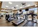 Well-equipped gym with modern cardio machines, multiple ceiling fans, and plenty of natural light at 10758 E Peralta Canyon Dr, Gold Canyon, AZ 85118