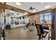 Spacious gym features weight machines, free weights, and mirrors for a complete workout at 10758 E Peralta Canyon Dr, Gold Canyon, AZ 85118